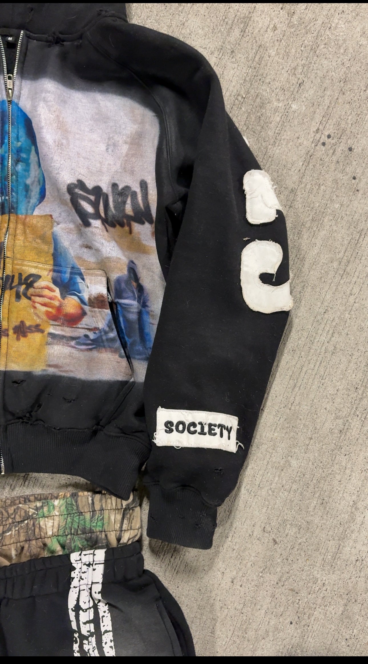 “Life sucks“ black distressed zip up